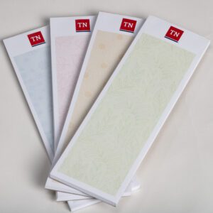 A group of four papers with different colors on them.