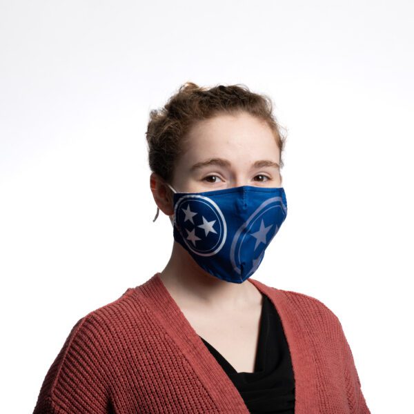 A woman wearing a blue mask with the state of tennessee on it.