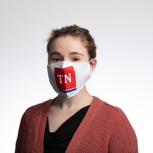 A woman wearing a face mask with the state of tennessee on it.